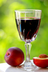 Glass of red wine and fruit.