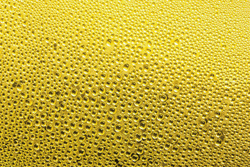 Water drop on glass in Yellow