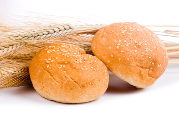 Fresh bread with ears of wheat
