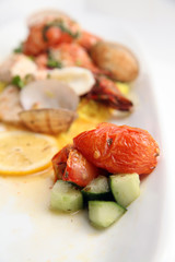grilled tomato with seafood at background