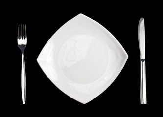 square white plate fork and knife isolated on black background