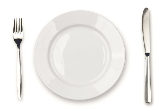 Knife, white plate and fork isolated