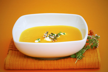 Pumpkin soup with sour cream and thyme