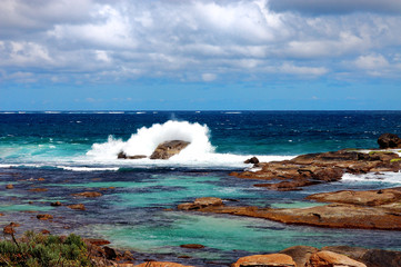 Waves crashing against a rock