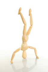 Artist's mannequin standing on its head