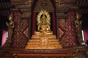 Golden Budha between angels on side