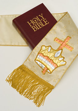Holy Bible with cross and crown stole