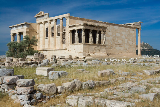 Ancient Temple Erechtheion in Acropolis Athens Greece on blue sk