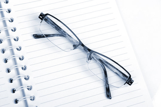 glasses on notebook