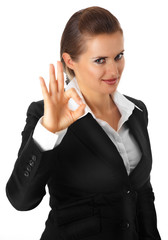 smiling modern business woman showing ok gesture isolated