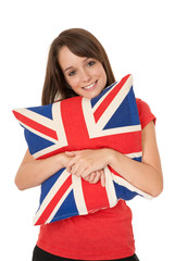 Girl cuddling Union Jack cushion © hartphotography