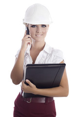 young woman holding some documents and talking at the phone