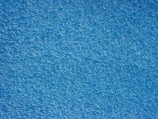 Background with blue foamed polyethylene.