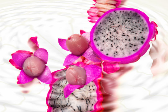 half of dragon fruit and litchi ove white