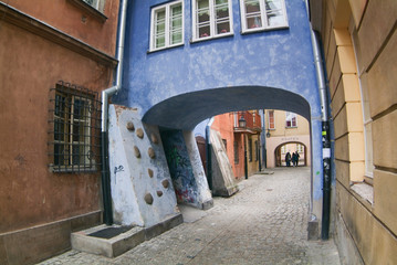 Archway at tenement house at Warsaw's old town.