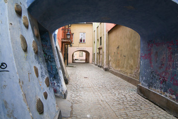 Archway at tenement house at Warsaw's old town.