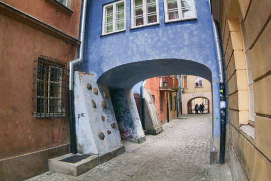 Archway at tenement house at Warsaw's old town.
