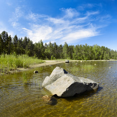 Stone in shallow water at Ladoga lake