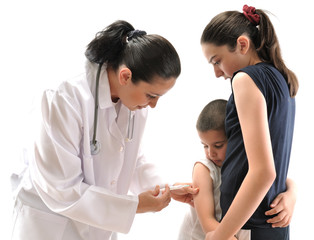 Little boy scared of injection hugging his sister.