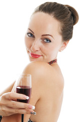 Studio portrait of a beautiful woman holding a glass of red wine