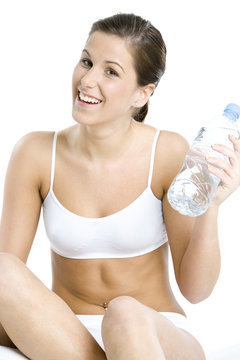 portrait of sitting woman with bottle of water