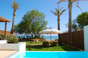 Swimming pool with jacuzzi at the beach of modern luxury villa,