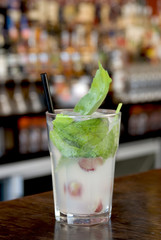 Exotic Grape Basil Lemonade with black straw.