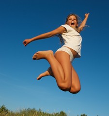 Obraz premium Happy little girl jumping