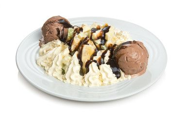 Whipped cream dessert with fruits and ice chocolate cream