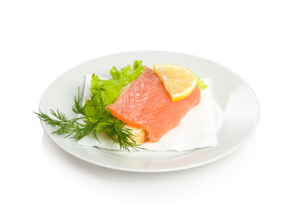 Open sandwich with salmon, lettuce, lemon and dill