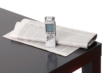 News gathering. Background with dictaphone and newspaper