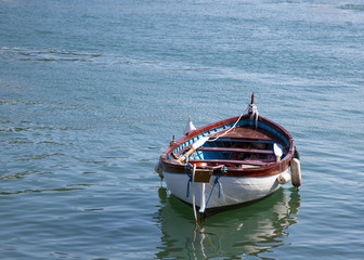italian fish boats in blue water