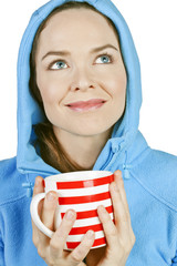 Beautiful fresh woman enjoying a cup of tea or coffe