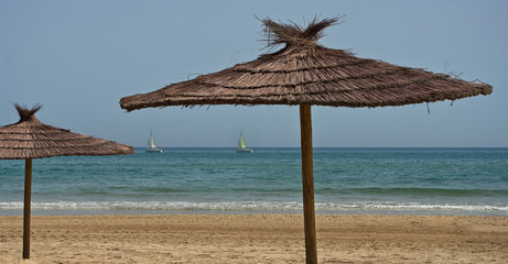 Two boats and two parasols