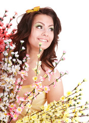 Girl with spring flower and butterfly .