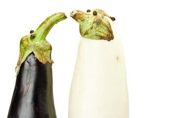 Black and white eggplants as funny puppets isolated on white
