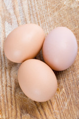 three brown eggs
