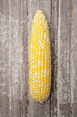 Vibrant Yellow Corn on Rustic Wood