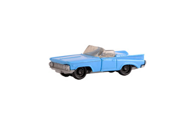 Funky old dirty plastic small toy blue cabriolet car on white