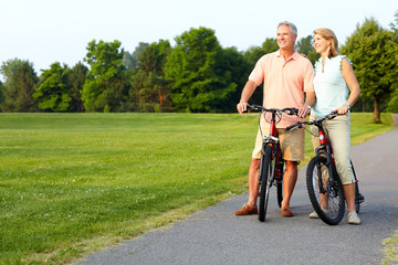 senior couple cycling