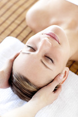 Fototapeta na wymiar Caucasian relaxed woman having a head massage