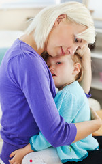 Fototapeta premium Blond woman taking care of her child