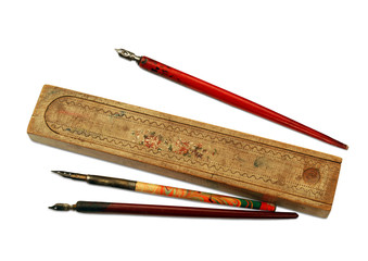 Vintage pens and wooden pen case, isolated