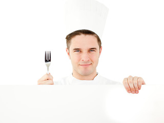 Happy young man holding a fork and a placard