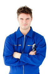 Charismatic mechanic holding tool smiling at the camera