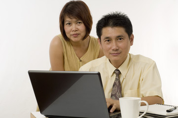 Asian couple  working together