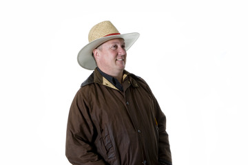 man in cowboy hat and oilskin coat