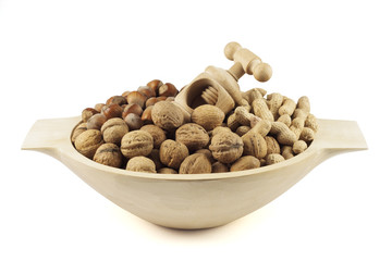 Wooden dish with nutcracker and nuts