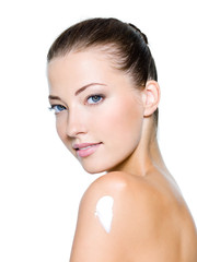 Fototapeta premium woman with moisturizer cream on shoulder