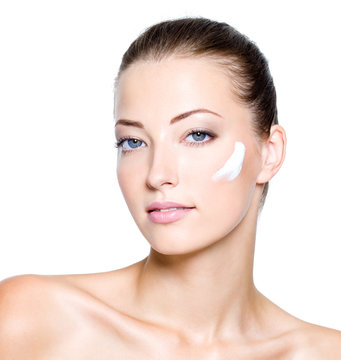 woman with moisturizer cream on face